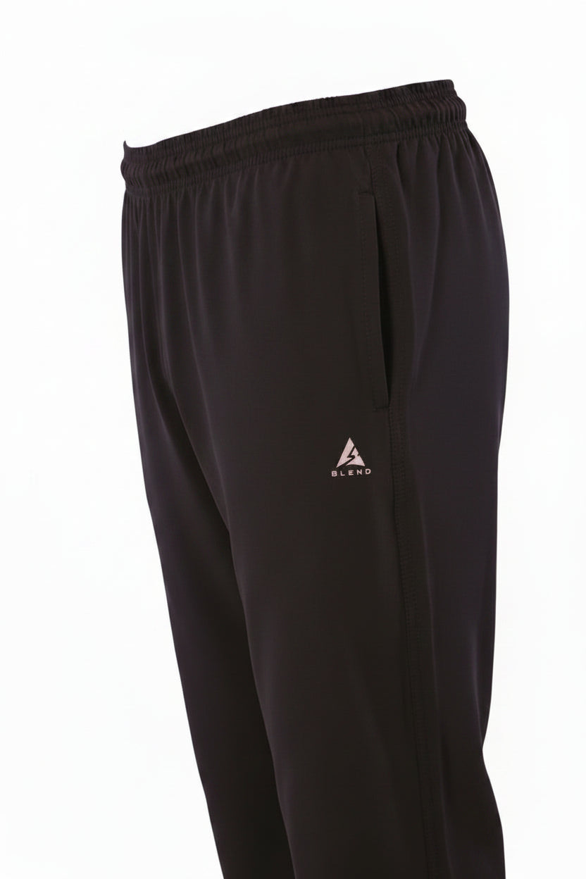 Front three-quarter ghost mannequin product shot of men's solid gray track pants. The pants feature an elastic waistband and a silver 'A BLEND' logo on the left thigh, displayed as a hollow garment against a pure white studio background.