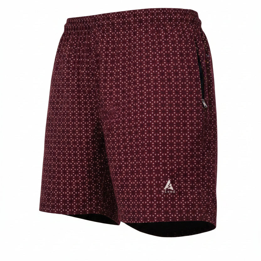 Rear three-quarter view of men's maroon shorts with a white geometric pattern. Features include an elastic waistband, a black side zipper pocket, and a silver Blend logo on the lower leg. The shorts are displayed as a hollow ghost mannequin on a pure white background.