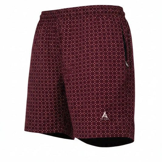 Rear three-quarter view of men's maroon shorts with a white geometric pattern. Features include an elastic waistband, a black side zipper pocket, and a silver Blend logo on the lower leg. The shorts are displayed as a hollow ghost mannequin on a pure white background.